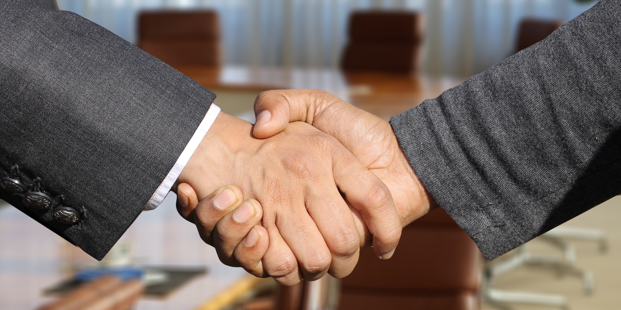 Shaking hands to show commitment